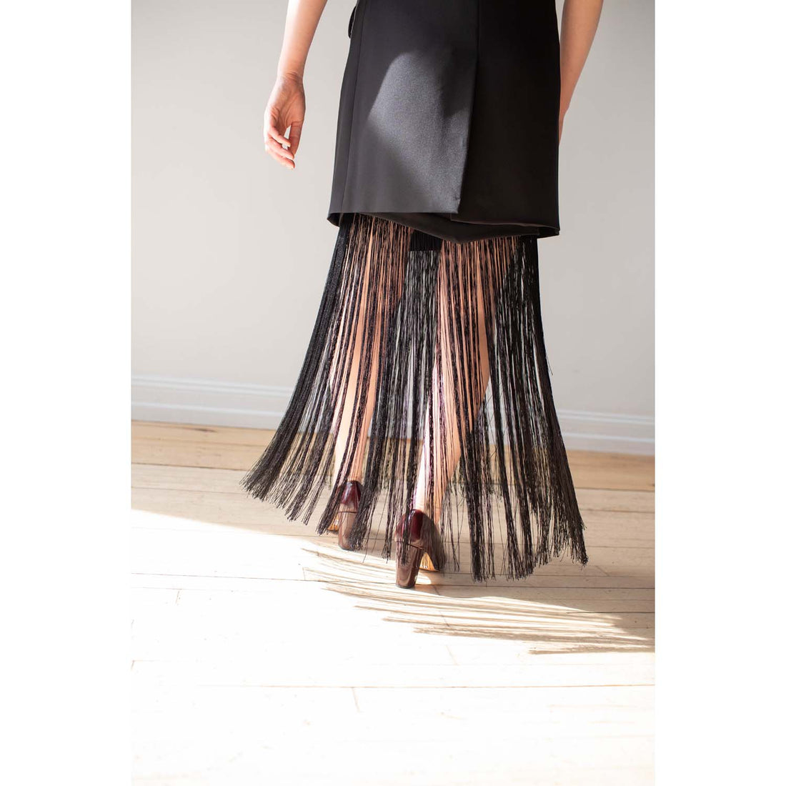 Nomia Asymmetric Fringe Skirt in Black