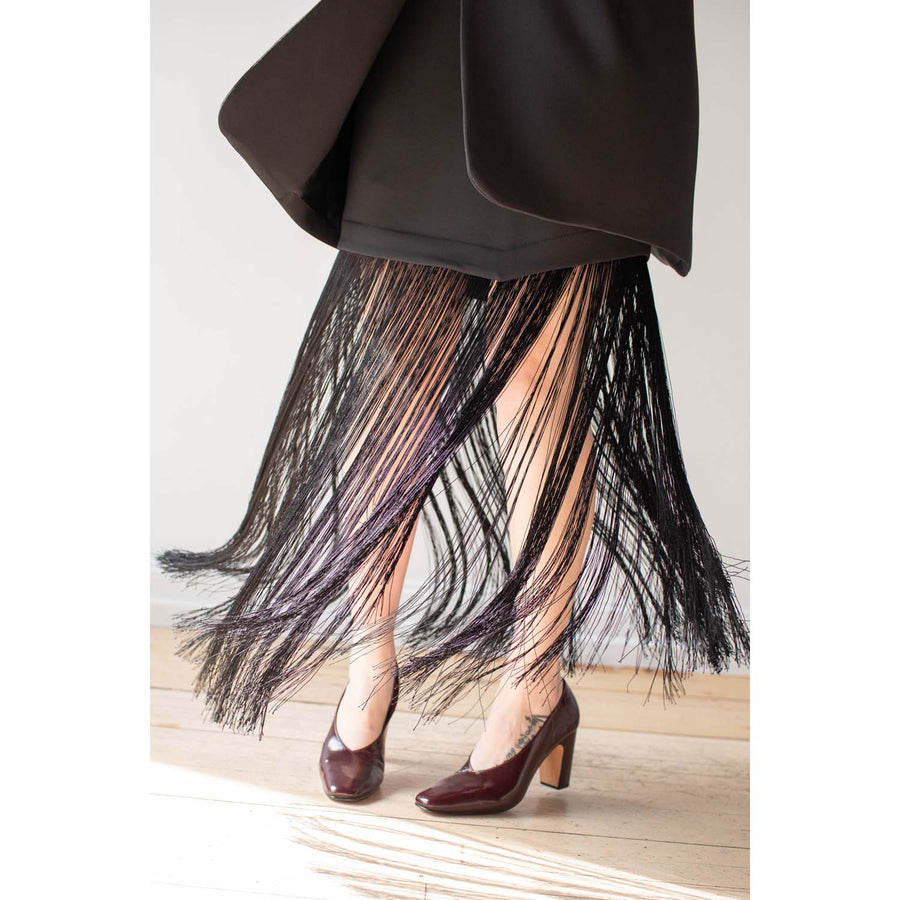 Nomia Asymmetric Fringe Skirt in Black