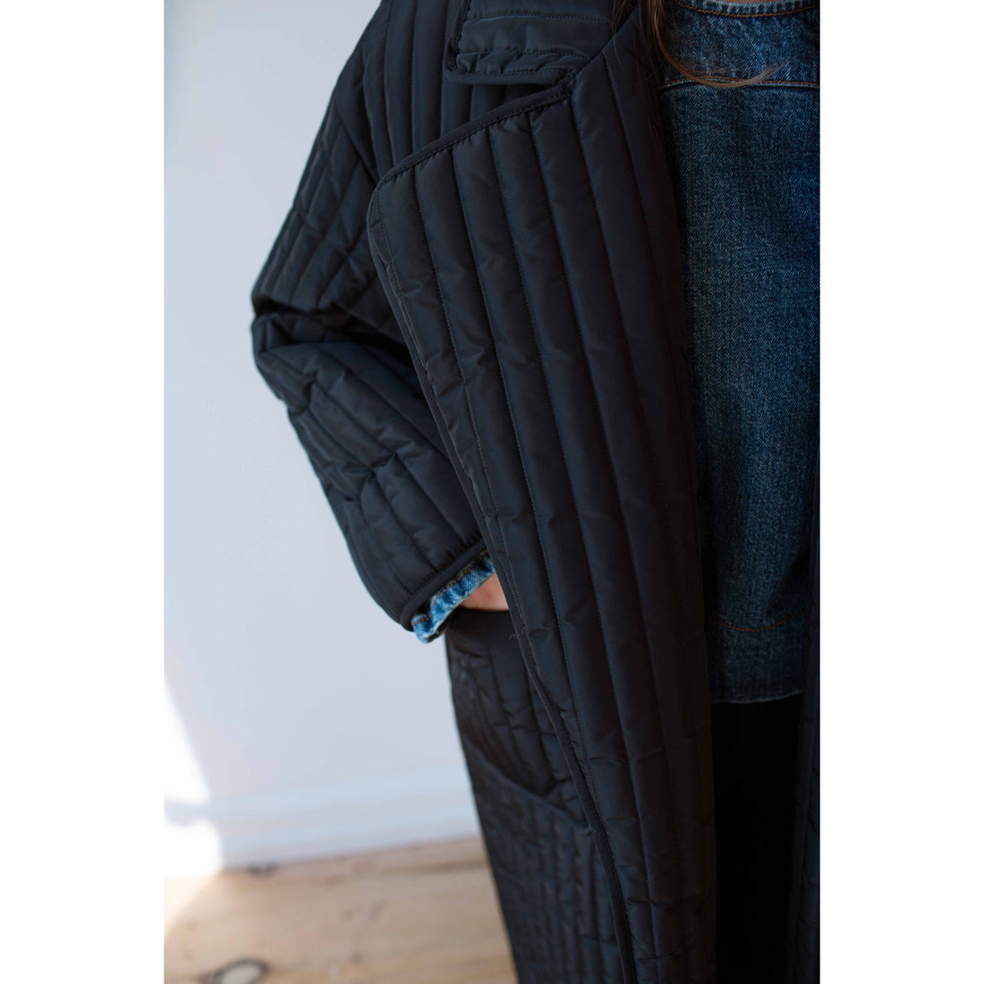 Nomia Quilted Overcoat in Black